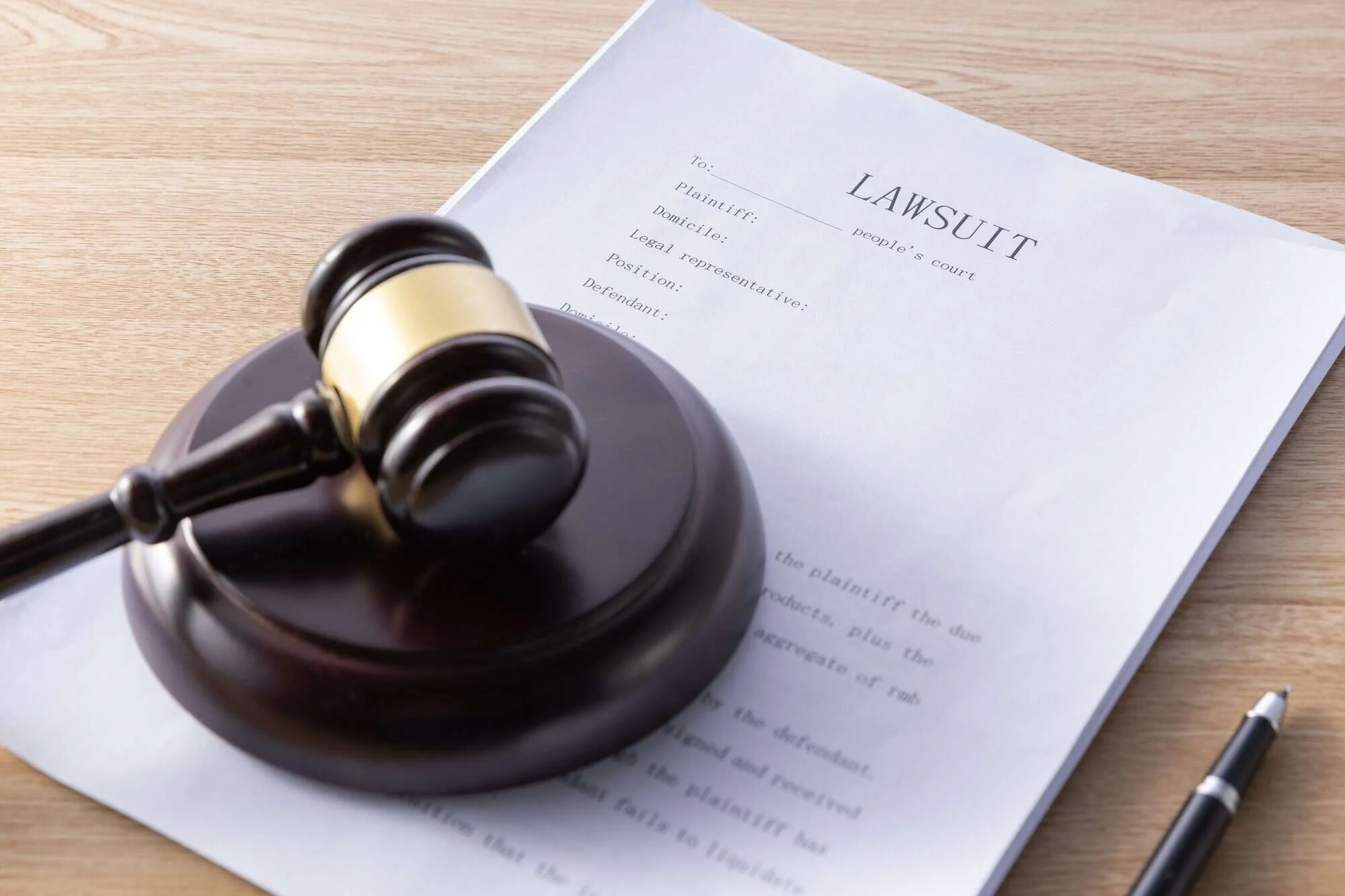 Judge's gavel on lawsuit papers representing life insurance litigation in Naples, Florida