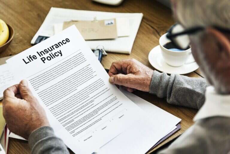 Life insurance lawyer in Naples reviewing a denied life insurance policy